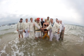 THE SOLENT, UK - August 31st: For a briefÊspellÊonce each summer on the lowest of spring tides, members of the Island Sailing Club and Royal Southern Yacht Club sail outÊto The Brambles sand bank in the middle of The Solent andÊplay cricket, before the tide rushes back in one hour later.ÊThe fixture was first started in the 1950Õs by the late Uffa Fox, a sailing companion of the Duke of Edinburgh, the Royal Southern and the Island Sailing Club compete every year. As soon as the sandbank appears the stumps are put up and the match gets under way. Many of the competitors dress all in cricket whites and ÔThe Bramble InnÕ is erected to serve drinks to spectators. The Bramble Inn is one of the most bizarre pubs in England: it is in the middle of the sea and exists only for about an hour each year.