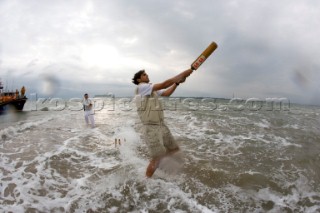 THE SOLENT, UK - August 31st: For a briefÊspellÊonce each summer on the lowest of spring tides, members of the Island Sailing Club and Royal Southern Yacht Club sail outÊto The Brambles sand bank in the middle of The Solent andÊplay cricket, before the tide rushes back in one hour later.ÊThe fixture was first started in the 1950Õs by the late Uffa Fox, a sailing companion of the Duke of Edinburgh, the Royal Southern and the Island Sailing Club compete every year. As soon as the sandbank appears the stumps are put up and the match gets under way. Many of the competitors dress all in cricket whites and ÔThe Bramble InnÕ is erected to serve drinks to spectators. The Bramble Inn is one of the most bizarre pubs in England: it is in the middle of the sea and exists only for about an hour each year.