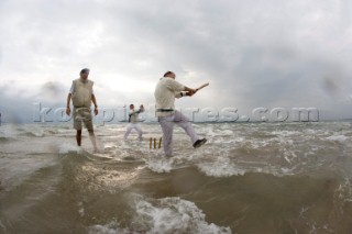 THE SOLENT, UK - August 31st: For a briefÊspellÊonce each summer on the lowest of spring tides, members of the Island Sailing Club and Royal Southern Yacht Club sail outÊto The Brambles sand bank in the middle of The Solent andÊplay cricket, before the tide rushes back in one hour later.ÊThe fixture was first started in the 1950Õs by the late Uffa Fox, a sailing companion of the Duke of Edinburgh, the Royal Southern and the Island Sailing Club compete every year. As soon as the sandbank appears the stumps are put up and the match gets under way. Many of the competitors dress all in cricket whites and ÔThe Bramble InnÕ is erected to serve drinks to spectators. The Bramble Inn is one of the most bizarre pubs in England: it is in the middle of the sea and exists only for about an hour each year.