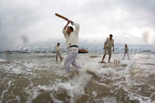 THE SOLENT, UK - August 31st: For a briefÊspellÊonce each summer on the lowest of spring tides, members of the Island Sailing Club and Royal Southern Yacht Club sail outÊto The Brambles sand bank in the middle of The Solent andÊplay cricket, before the tide rushes back in one hour later.ÊThe fixture was first started in the 1950Õs by the late Uffa Fox, a sailing companion of the Duke of Edinburgh, the Royal Southern and the Island Sailing Club compete every year. As soon as the sandbank appears the stumps are put up and the match gets under way. Many of the competitors dress all in cricket whites and ÔThe Bramble InnÕ is erected to serve drinks to spectators. The Bramble Inn is one of the most bizarre pubs in England: it is in the middle of the sea and exists only for about an hour each year.