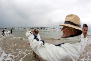 THE SOLENT, UK - August 31st: For a briefÊspellÊonce each summer on the lowest of spring tides, members of the Island Sailing Club and Royal Southern Yacht Club sail outÊto The Brambles sand bank in the middle of The Solent andÊplay cricket, before the tide rushes back in one hour later.ÊThe fixture was first started in the 1950Õs by the late Uffa Fox, a sailing companion of the Duke of Edinburgh, the Royal Southern and the Island Sailing Club compete every year. As soon as the sandbank appears the stumps are put up and the match gets under way. Many of the competitors dress all in cricket whites and ÔThe Bramble InnÕ is erected to serve drinks to spectators. The Bramble Inn is one of the most bizarre pubs in England: it is in the middle of the sea and exists only for about an hour each year.