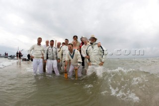 THE SOLENT, UK - August 31st: For a briefÊspellÊonce each summer on the lowest of spring tides, members of the Island Sailing Club and Royal Southern Yacht Club sail outÊto The Brambles sand bank in the middle of The Solent andÊplay cricket, before the tide rushes back in one hour later.ÊThe fixture was first started in the 1950Õs by the late Uffa Fox, a sailing companion of the Duke of Edinburgh, the Royal Southern and the Island Sailing Club compete every year. As soon as the sandbank appears the stumps are put up and the match gets under way. Many of the competitors dress all in cricket whites and ÔThe Bramble InnÕ is erected to serve drinks to spectators. The Bramble Inn is one of the most bizarre pubs in England: it is in the middle of the sea and exists only for about an hour each year.