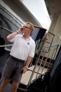 Crew using mobile telephone communication onboard superyacht  - MODEL RELEASED -