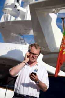 Crew using mobile telephone communication onboard superyacht  - MODEL RELEASED -