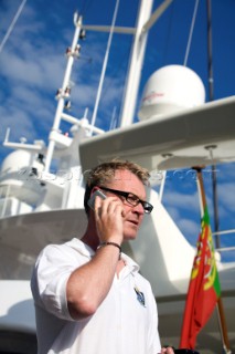 Crew using mobile telephone communication onboard superyacht  - MODEL RELEASED -