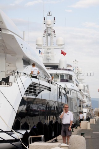 Crew using mobile telephone communication onboard superyacht   MODEL RELEASED 