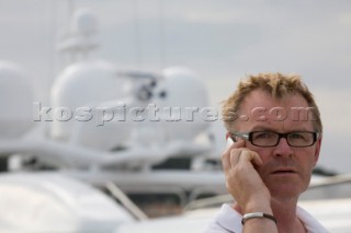 Crew using mobile telephone communication onboard superyacht  - MODEL RELEASED -