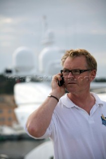 Crew using mobile telephone communication onboard superyacht  - MODEL RELEASED -