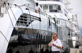 Crew using mobile telephone communication onboard superyacht  - MODEL RELEASED -