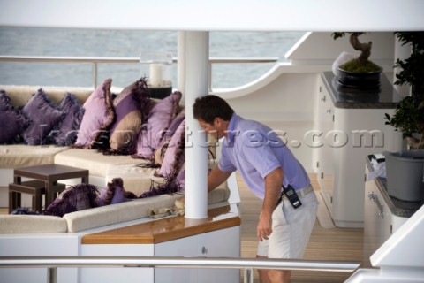 Crew working maintenance onboard superyacht   MODEL RELEASED 