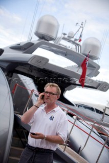 Crew using mobile telephone communication onboard superyacht  - MODEL RELEASED -