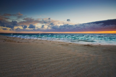 Colourful sunset over a sandy beach