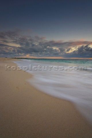 Moody sky over a sandy beach at dusk