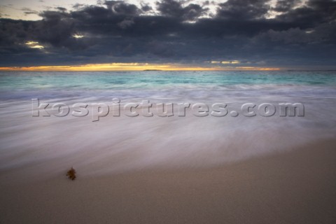 Moody sky over a sandy beach at dusk