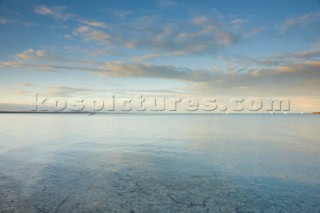 Sunrise over a calm bay