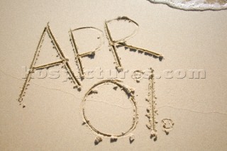 Zero percent APR 0% sign writing message on a sandy beach in Tarifa, Spain, near Gibraltar.