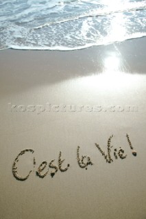 Cest La Vie its life sign writing message on a sandy beach in Tarifa, Spain, near Gibraltar.