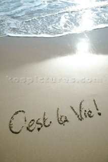 Cest La Vie its life sign writing message on a sandy beach in Tarifa, Spain, near Gibraltar.