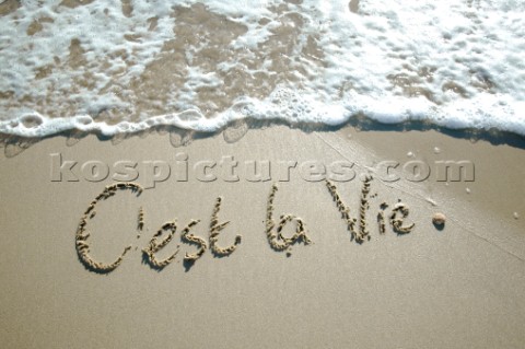 Cest La Vie its life sign writing message on a sandy beach in Tarifa Spain near Gibraltar