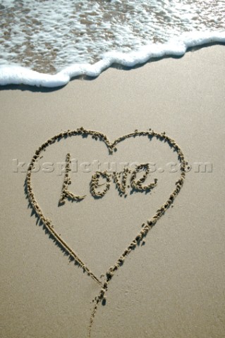 Mi Amore love romantic sign writing message on a sandy beach in Tarifa Spain near Gibraltar