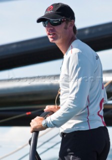 Ernesto Bertarelli driving Alinghi 5, the giant catamaran multihull which will defend the 33rd Americas Cup sailing on Lake Geneva. (Editorial Only)