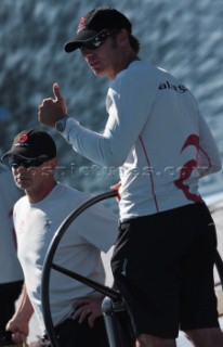 Ernesto Bertarelli driving Alinghi 5, the giant catamaran multihull which will defend the 33rd Americas Cup sailing on Lake Geneva. (Editorial Only)