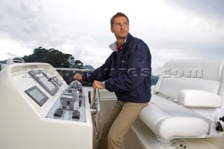 A romantic couple relaxing onboard a Vicel 72 classic motor yacht.  Model Released.