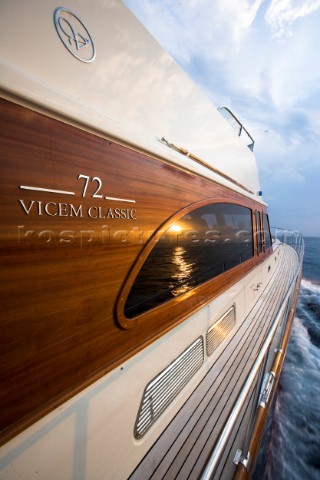 A romantic couple relaxing onboard a Vicel 72 classic motor yacht  Model Released