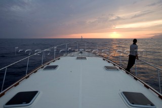 A romantic couple relaxing onboard a Vicel 72 classic motor yacht.  Model Released.