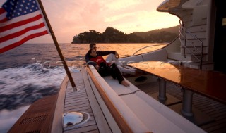 A romantic couple relaxing onboard a Vicel 72 classic motor yacht.  Model Released.