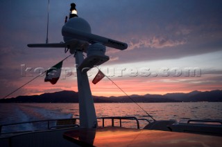 A romantic couple relaxing onboard a Vicel 72 classic motor yacht.  Model Released.