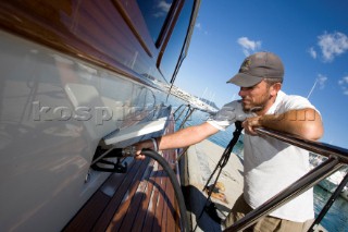 A romantic couple relaxing onboard a Vicel 72 classic motor yacht.  Model Released.