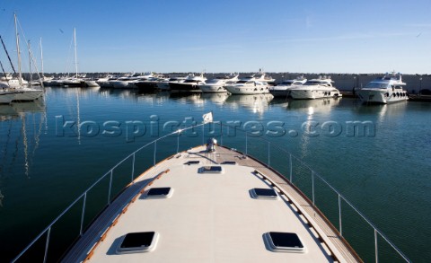 A romantic couple relaxing onboard a Vicel 72 classic motor yacht  Model Released