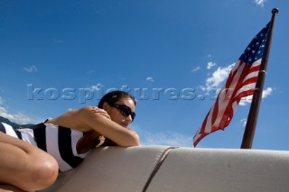 Lifestyle girl female onboard a Vicem 72 classic motor yacht Model Released.