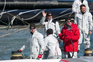 FEBRUARY 12TH 2010, VALENCIA, SPAIN: Ernesto Bertarelli (in red) on Alinghi 5 catamaran during the 1st match of the 33rd Americas Cup in Valencia, Spain.