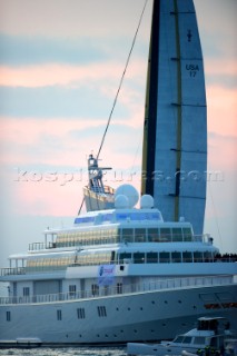 Race 2 BMW Oracle winning the 33rd Americas Cup in Valencia, Spain sailing past the superyacht mother ship Rising Sun