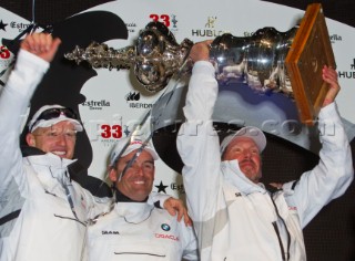 Valencia, 2/14/10. Alinghi5 33rd Americas Cup. Day 7 - Race 2. GGYC wins the 33rd Americas Cup Match. James Spithill, Russell Coutts, Larry Ellison. Guido Trombetta / Alinghi/SEASEE.COM