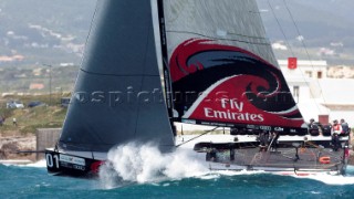 Emirates Team New Zealand pounds to windward mark three in the coastal race of the Trophy of Portugal, Med Cup regatta. Cascais, Portugal. 15/5/2010