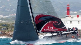 Emirates Team New Zealand pounds to windward mark three in the coastal race of the Trophy of Portugal, Med Cup regatta. Cascais, Portugal. 15/5/2010