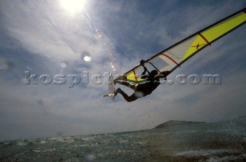 Donkey Kick        Windsurfer gets big air off a wave