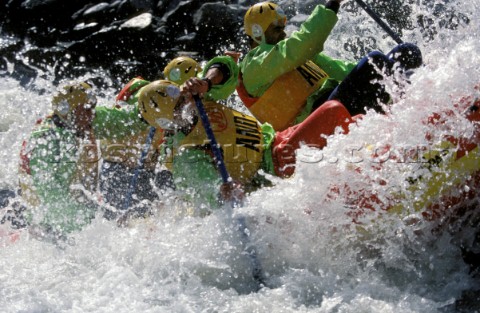 White water rafting down rapids in Austrian mountains