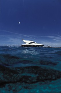 Fairline Phantom 43 at anchor in clear shallow water