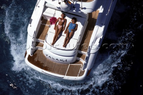 Two women sunbathing on sundeck of Fairline Targa 48