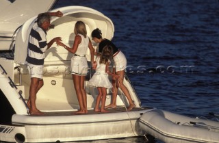 People on swimming platform on Fairline Targa 48