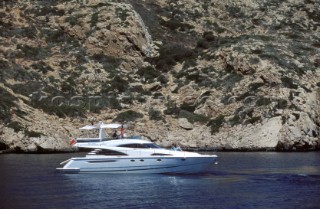 A luxurious Fairline Squadron 58 at rest in a tranquil bay in Majorca