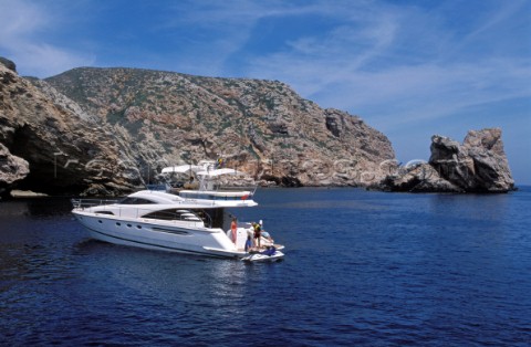 A luxurious Fairline Squadron 58 at rest in a tranquil bay in Majorca