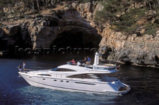 A luxurious Fairline Squadron 58 at rest in a tranquil bay in Majorca