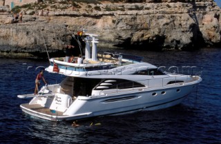 A luxurious Fairline Squadron 58 at rest in a tranquil bay in Majorca