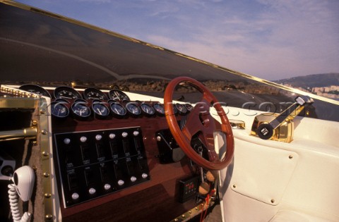 Wooden steering wheel on a classic motor launch