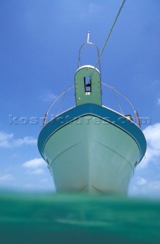 Profile of moored motor boat from surface of the water